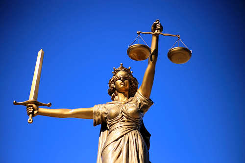 Lady justice statue holding sword and scales